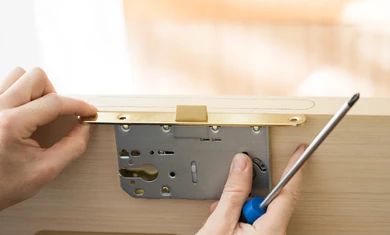 handyman-installing-lock-front-wooden-260nw-1748699843.jpg